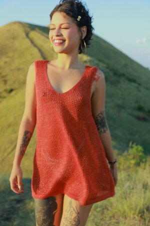 Lilith Baph teases in red dress atop sunlit hills, white underwear peeking as she poses with wild energy — Lilith Baph #1