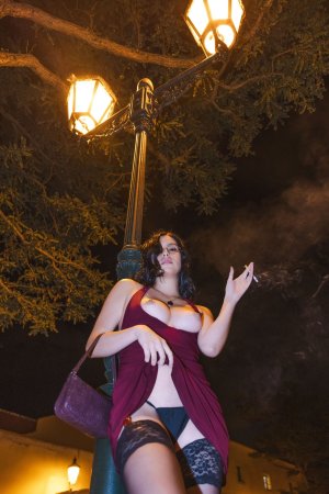 Sensual Sally Hunter in red dress smoking at night, no underwear showing through fabric, outdoor tease — Sally Hunter #4