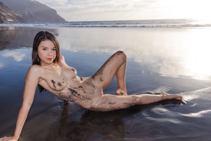 Sky Moon poses in black lace lingerie on volcanic beach at sunset her curves glistening wet from ocean waves — Sky Moon #11