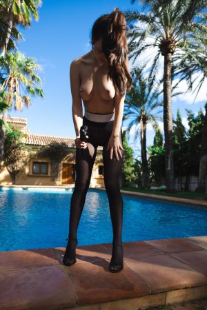 Toree starts demure by the pool then teases in sheer black lingerie with a sly grin and playful pose — Toree #23