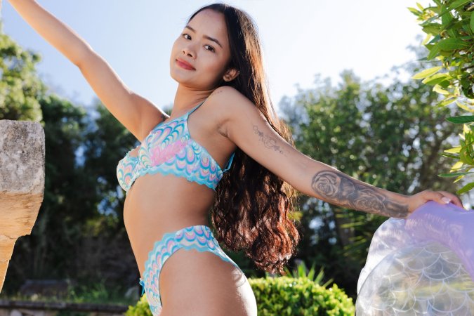 Liloo teases in mermaid lingerie beside a pool float, her tattooed thigh and white heels stealing the show — Liloo #2