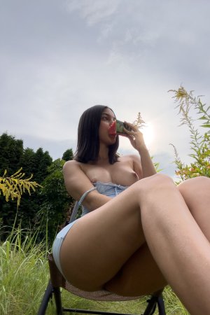 Gia Rosse in light blue lingerie poses solo outdoors, greenery framing her self portrait under natural light — Gia Rosse #7