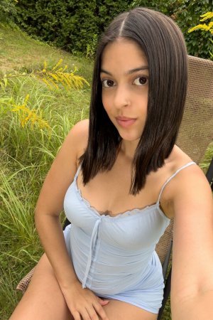 Gia Rosse in light blue lingerie poses solo outdoors, greenery framing her self portrait under natural light — Gia Rosse #24