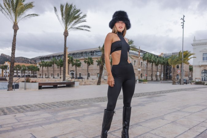Irene Rouse teases in black bodysuit and fur hat by the Ferris wheel, her curves on full display for the camera — Irene Rouse #3