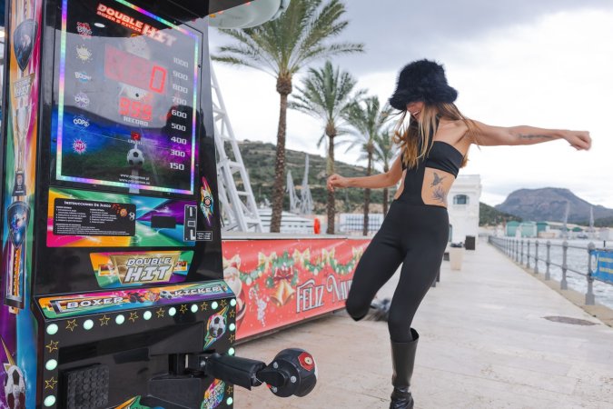 Irene Rouse teases in black bodysuit and fur hat by the Ferris wheel, her curves on full display for the camera — Irene Rouse #8