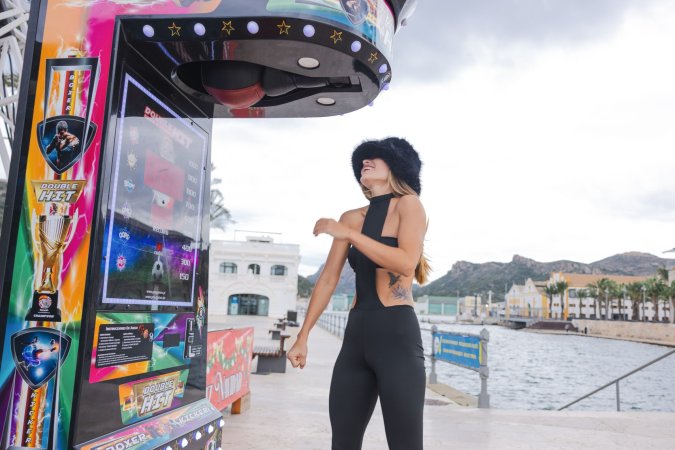 Irene Rouse teases in black bodysuit and fur hat by the Ferris wheel, her curves on full display for the camera — Irene Rouse #9