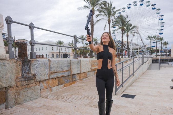 Irene Rouse teases in black bodysuit and fur hat by the Ferris wheel, her curves on full display for the camera — Irene Rouse #22