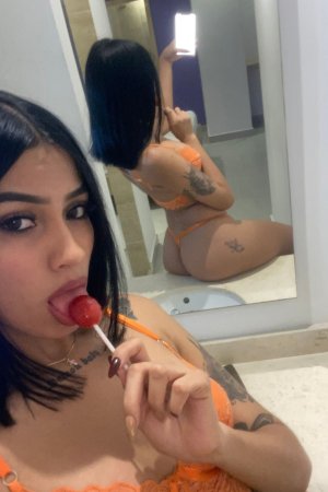 Sofia sits on the bathroom sink in orange lingerie taking mirror selfies showing her tattooed ass — Sofia #7