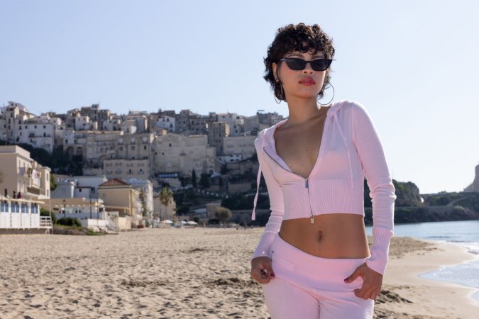 Lilith Baph teases in her pink tracksuit outdoors, unzipped top revealing her curves against mountain views — Lilith Baph #6