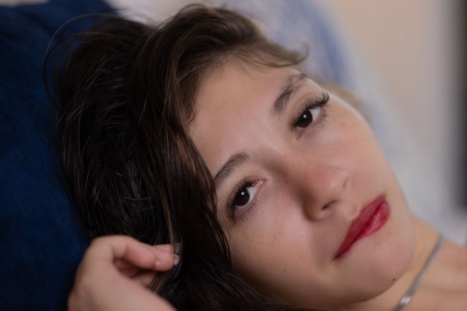 Sophia Gonzales sits barefoot on bed, topless with floral underwear, teasing with her toy in cozy bedroom — Sophia Gonzales #13