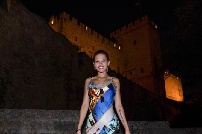 Irene Rouse commands the evening street in a daring dress, posing with legs spread for the camera — Irene Rouse #11