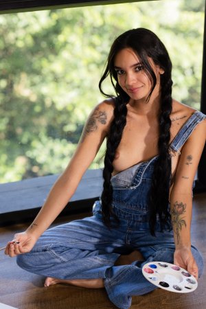 Dulce sits floor by window painting then strips to masturbate with dildo in denim overalls — Dulce #3