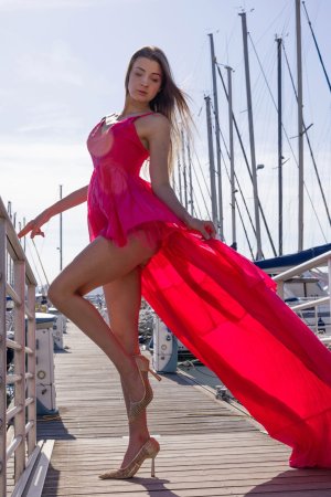 Maria in a daring pink dress teasing on a Cannes balcony with sea views and high heels — Maria #18