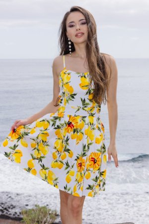 Li Moon in lemon print dress on rocky cliffs, posing solo by the ocean breeze and sun — Li Moon #1