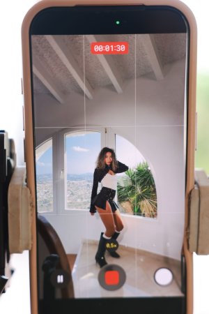 Valery Ponce in black boots and white socks, kneeling on tiled stairs, teasing with her legs spread — Valery Ponce #4