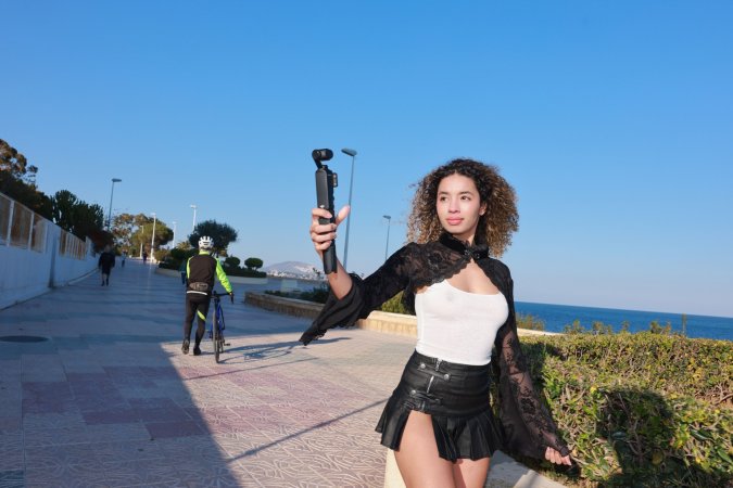 Valery Ponce stands poised on the Spanish coast, blonde curls framing her face as she poses in black boots and lace, sunlight tracing every curve — Valery Ponce #19