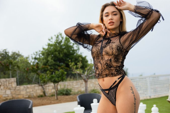Rika Fane teases in black lace on giant chessboard then fingers her pussy to climax outdoors — Rika Fane #1