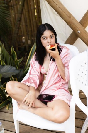Gia Rosse teases in pink lingerie, barefoot on a rock by the pool, her legs spread just enough to make you want more — Gia Rosse #24