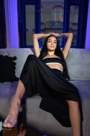 Dulce starts poised on the couch then melts into solo bliss under blue light with her toys — Dulce #1