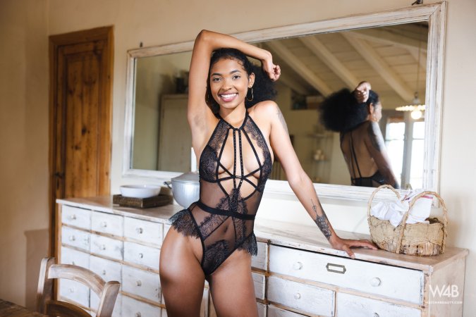 Barbie poses in sheer black lace on a white dresser smiling with tattoos and hoop earrings — Barbie #2