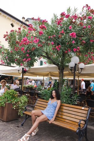 Valery Ponce bends over a gate by Lago Di Garda, flashing her bare ass in a tiny blue dress, teasing passersby — Valery Ponce #22