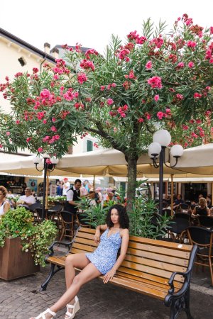 Valery Ponce bends over a gate by Lago Di Garda, flashing her bare ass in a tiny blue dress, teasing passersby — Valery Ponce #24