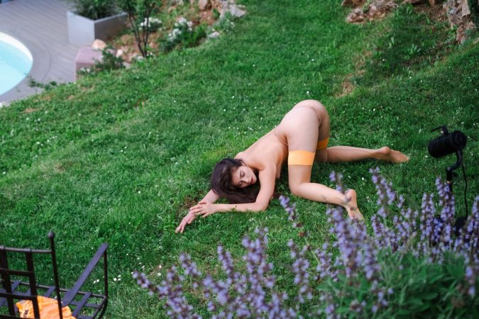 Alissa Foxy kneels on a chair outdoors in lace lingerie, posing with her legs spread for the camera — Alissa Foxy #18