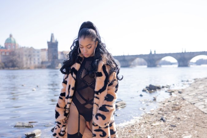 Sofi Vega teasing in sheer black lingerie and fur coat against Pragues river view, craving all eyes on her — Sofi Vega #13