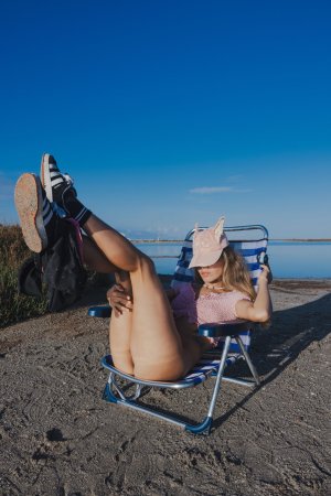 Irene Rouse spreads wide on stone wall under blue sky, solo pose showing off her gymnast flexibility — Irene Rouse #18