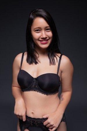 Lia Ponce in black lace, smiling slow then teasing her slit with glass toy in studio — Lia Ponce #1