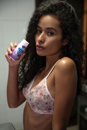 Mia Nix in pink floral lingerie, holding a bottle, skin glistening, slow tease in closeup — Mia Nix #1