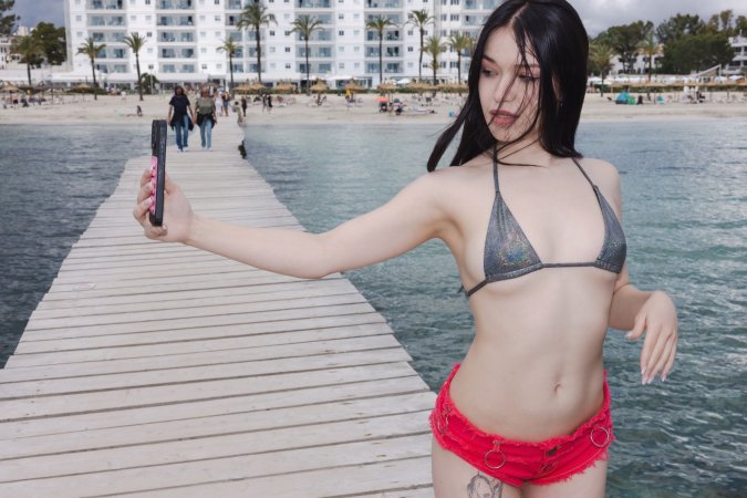 Wikki Kee takes sultry selfies in silver bikini and red shorts by the waterfront pier — Wikki Kee #2