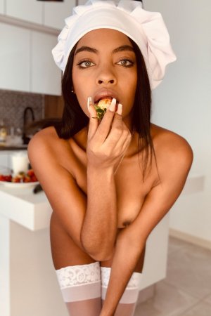 Sofi Vega naked in the kitchen, white stockings and chef hat, posing with a bottle, red heels on — Sofi Vega #9