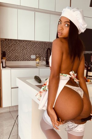 Sofi Vega naked in the kitchen, white stockings and chef hat, posing with a bottle, red heels on — Sofi Vega #21