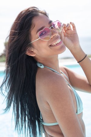 Karin Torres smiles in her bikini by the pool, playful and confident, showing off her toned body — Karin Torres #1