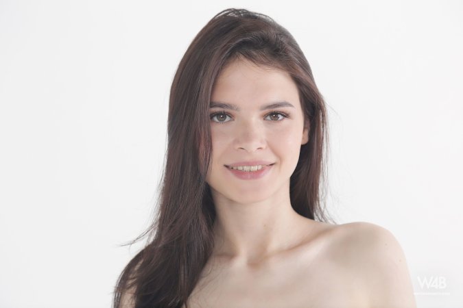 Lilly in black lingerie posing solo on white background hands on hips topless and teasing — Lilly #4