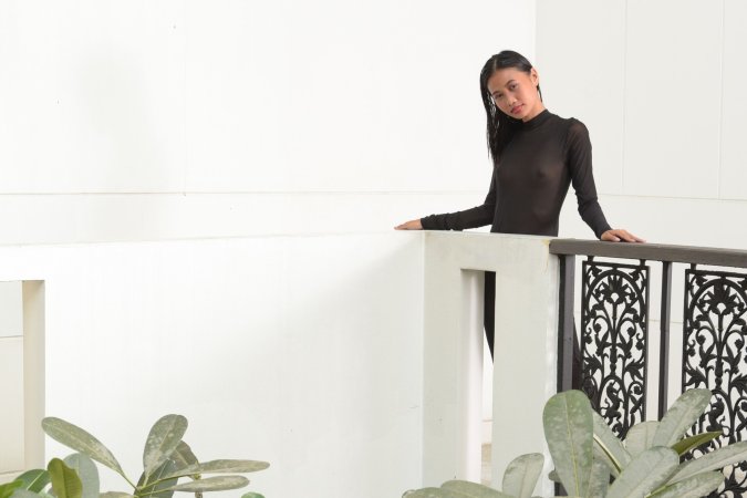 Hiromi teases in a sheer black dress, legs apart against white walls, heels clicking on tile floors — Hiromi #1