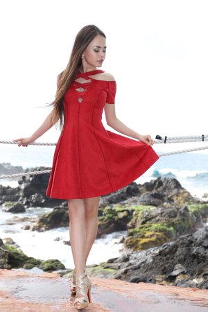 Li Moon in red off shoulder dress poses solo on rocky shore ocean breeze teasing her curves — Li Moon #2