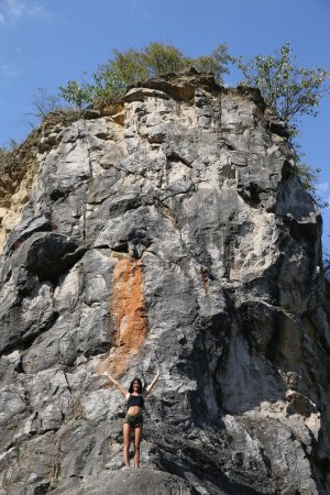Lady Dee commands the rocks barefoot, topless in camo shorts, teasing with a wild outdoor vibe — Lady Dee #1