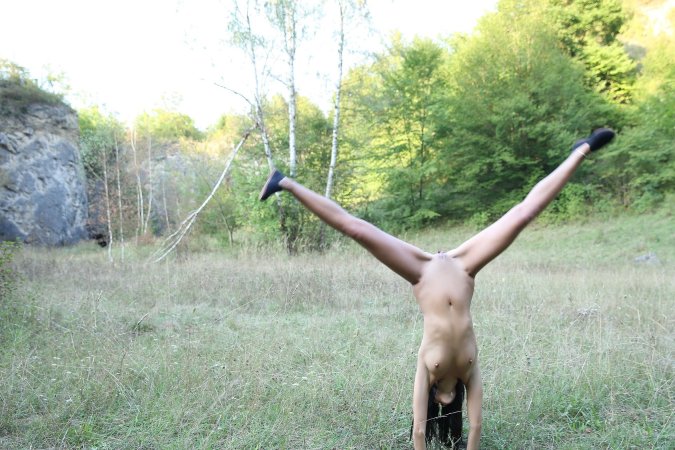 Lady Dee commands the rocks barefoot, topless in camo shorts, teasing with a wild outdoor vibe — Lady Dee #7