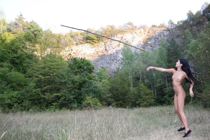 Lady Dee commands the rocks barefoot, topless in camo shorts, teasing with a wild outdoor vibe — Lady Dee #15