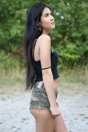Lady Dee commands the rocks barefoot, topless in camo shorts, teasing with a wild outdoor vibe — Lady Dee #19