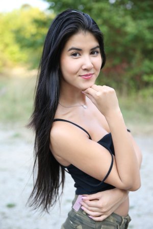 Lady Dee commands the rocks barefoot, topless in camo shorts, teasing with a wild outdoor vibe — Lady Dee #21