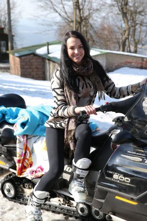 Sapphira applying makeup in car wearing tiger print sweater smiling with natural light and pink bag nearby — Sapphira #2