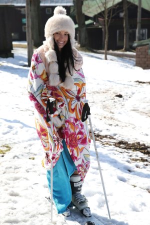 Sapphira applying makeup in car wearing tiger print sweater smiling with natural light and pink bag nearby — Sapphira #5