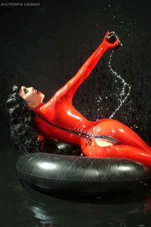 Shiny latex queens in high heels pose with whips, black hair and blonde curves on full display #18